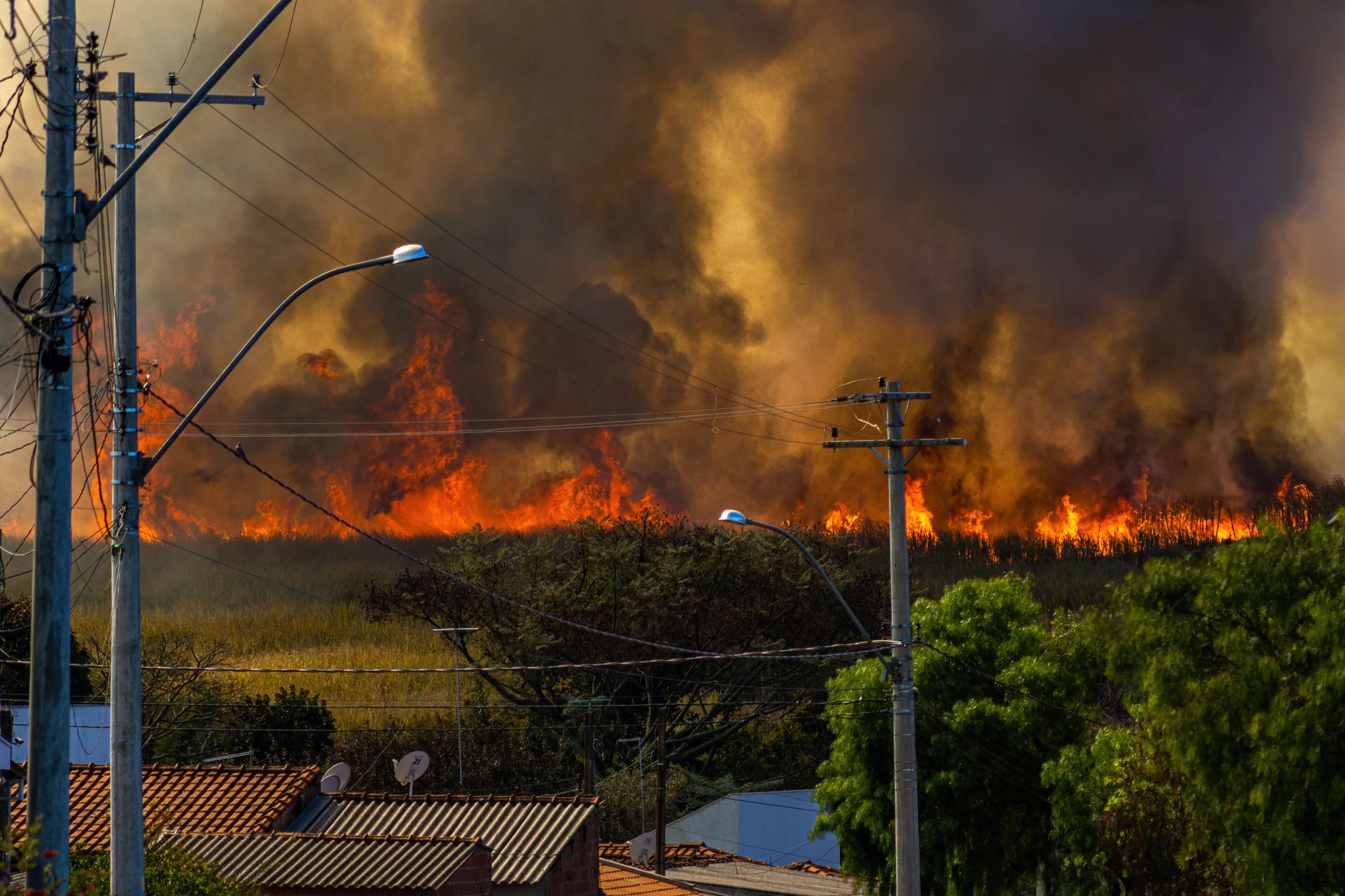 Two massive wildfires merge near Clinton, forcing evacuations of 583 properties