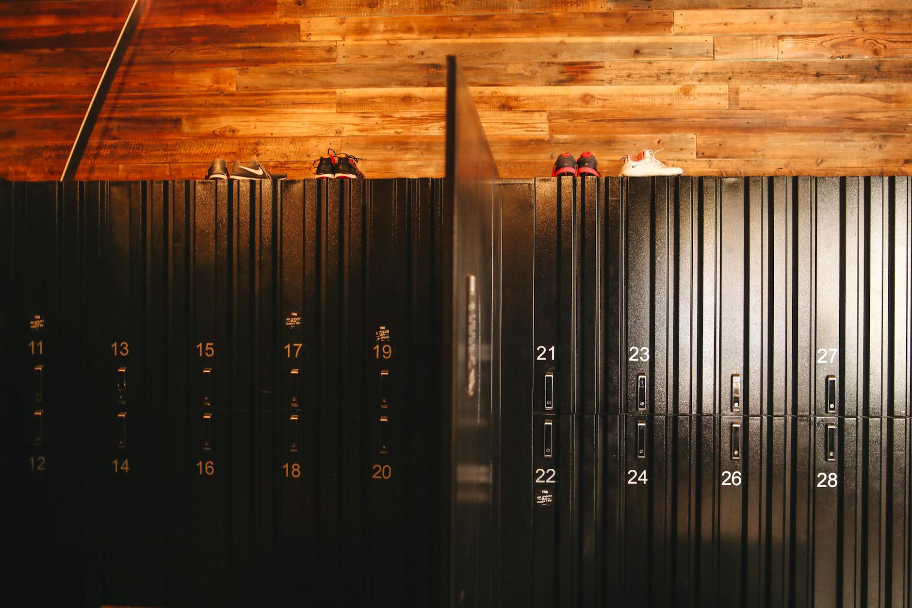 Three charged in cross-country gym locker-room credit card thefts