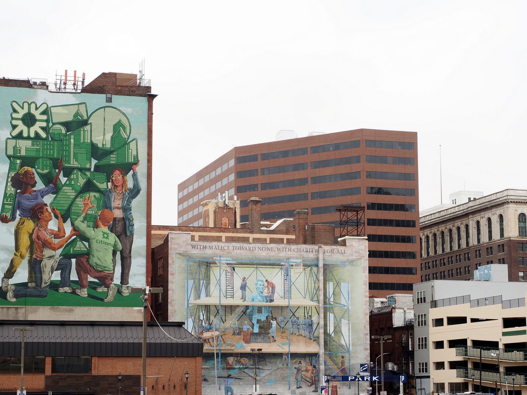 Downtown Murals Get First Major Restoration in 52 Years