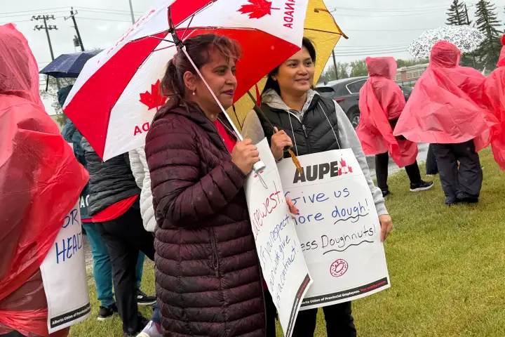 Health-care workers rally for better pay, working conditions