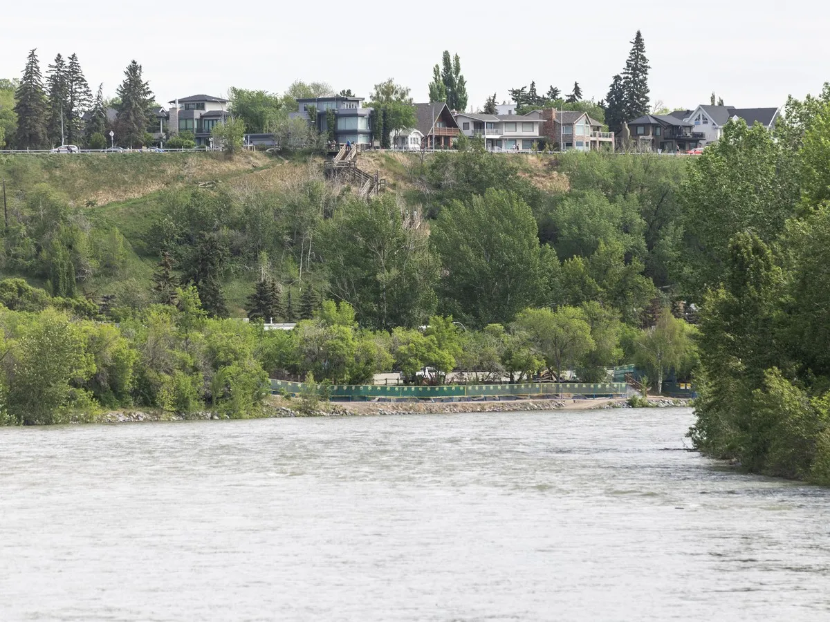 Bow River surges past safe levels as heavy rain continues